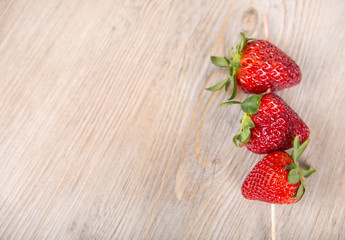 Fresh ripe strawberries on skewer.