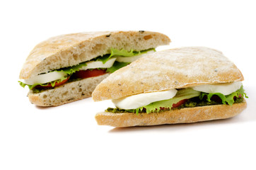 fresh sandwich with mozzarella, tomatoes and pesto