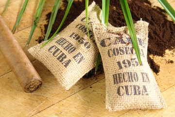Burlap sacks of Cuban coffee and a cigar