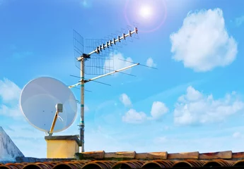 Fotobehang satellite antenna and sun © Gabriele Maltinti