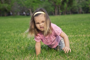 Fototapeta premium A girl shows a wild animal in the park