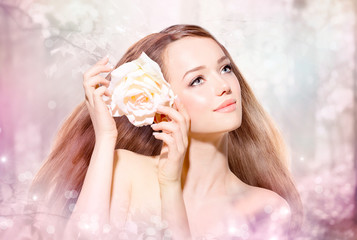 Beauty Girl Portrait. Spring Model with flower