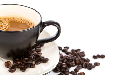 Coffee cup and beans on a white background