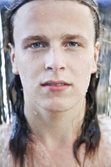 Portrait of a young man in the water