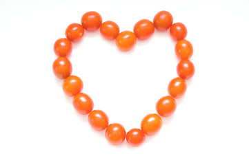 Sign heart from cherry tomatoes