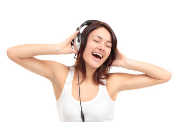 Woman with headphones listening music on player