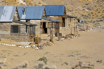 Ghost town cabins in abandoned mining camp in the Nevada desert.