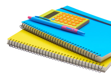 yellow and blue note book calculator and pen