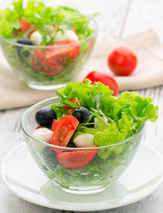 healthy food - salad with mozzarella, arugula and tomatoes
