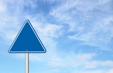 triangular road sign with sky