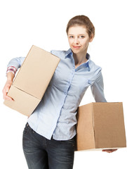 Smiling woman carrying two big boxes