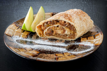 Plate with a piece of apple strudel