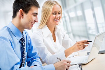 Businesspeople working at meeting