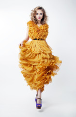 Shopping. Woman Blonde Fashion Model in Yellow Dress. Sales