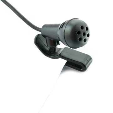 Small computer microphone with cable on white.