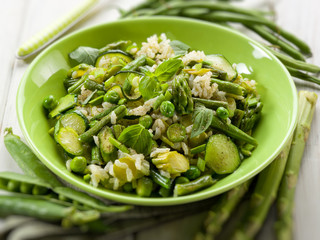 risotto with asparagus zucchinis and green beans, selective focu