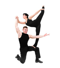 two young modern acrobats posing on white