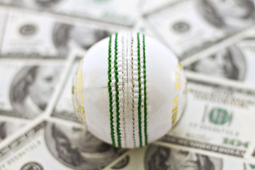Whtie Cricket ball on money