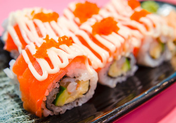 sushi salmon rolls with caviar and mayonnaise