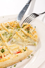 tasty quiche with cheese and herbs