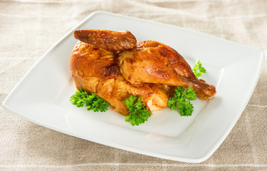 grilled chicken decorated with green parsley