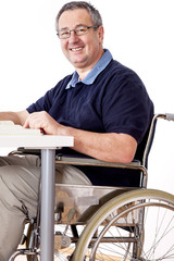 Man sitting in a wheelchair at the table