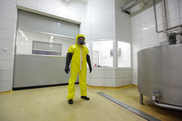 professional in protective uniform  in industrial environment