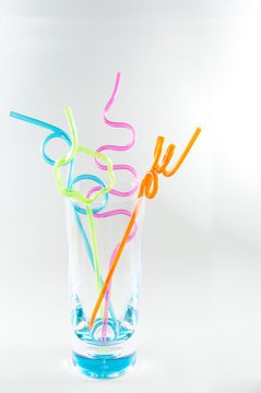 Colorful straws in glass