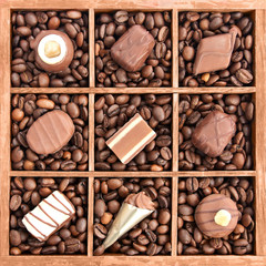 Assorted chocolates in wooden box with coffee beans