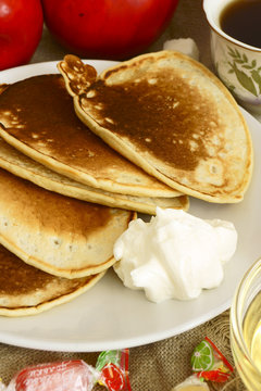 Pancakes with sour cream and syrup