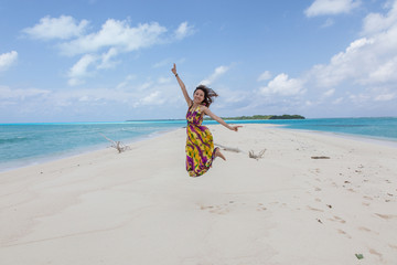 Young beautiful women on the sunny tropical beach