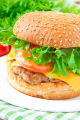 Tasty american lunch - cheeseburger with meat cutlet, cheese and