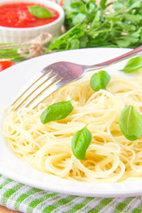 Traditional Italian simple dish - pasta with  olive oil and basi