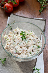 Smoked mackerel pate with eggs and herbs in glass bowl