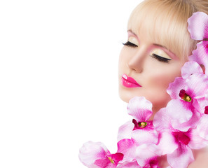 Beautiful girl with flowers and perfect makeup on white backgrou