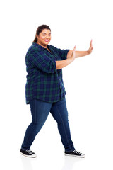 pretty plus size teenage girl pushing on empty copyspace