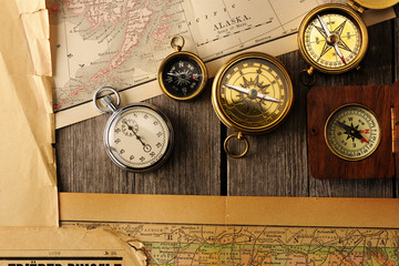 Antique compasses over old map