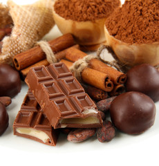 Composition of chocolate sweets, cocoa and spices, isolated