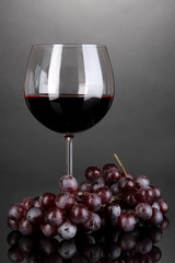 Red wine glass on grey background