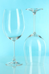 Two glasses on light blue background