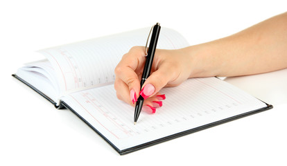 Hand signing in notebook, isolated on white