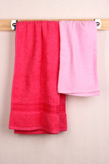 Bath towels on crossbar in room