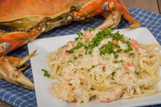 Dungeness crab pasta on white plate