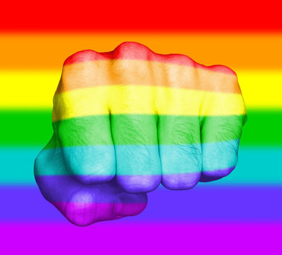 Fist of a man punching, rainbow flag pattern