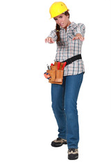 Tradeswoman holding out her arms