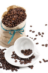 Coffee cup with burlap sack of roasted beans