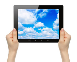 Woman hands holding tablet PC with sky on white background .