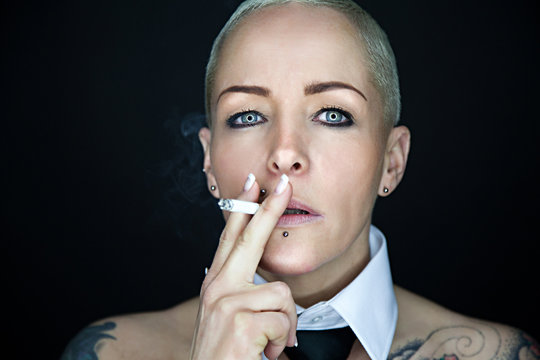 Portrait Of Beautiful Woman With Cigarette