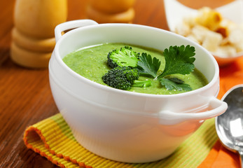 Broccoli cream soup on table