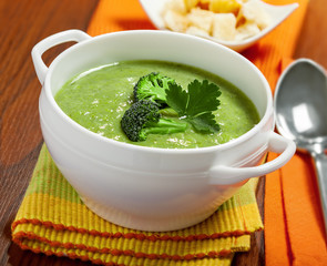 Broccoli cream soup on table